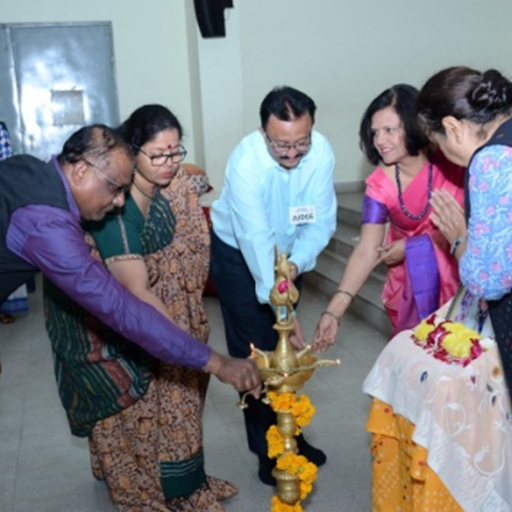 Dignitaries lighting the auspicious lamp and paying homage to  Smt.Savitaben Amin -Founder Navrachana Education Society.
